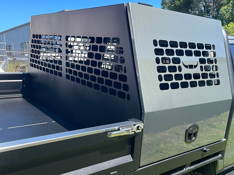 dog crate on ute with logo